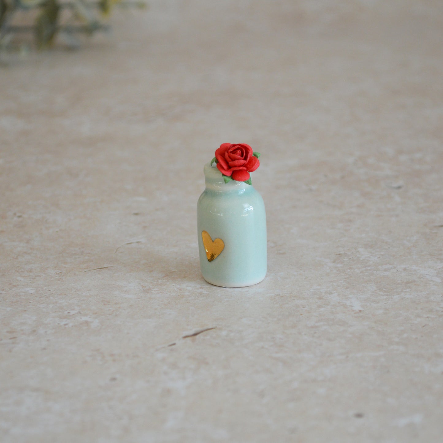 Seconds* Discontinued* Glazed Mini Bottle with an Embossed Gold Heart and a Red Paper Rose A113