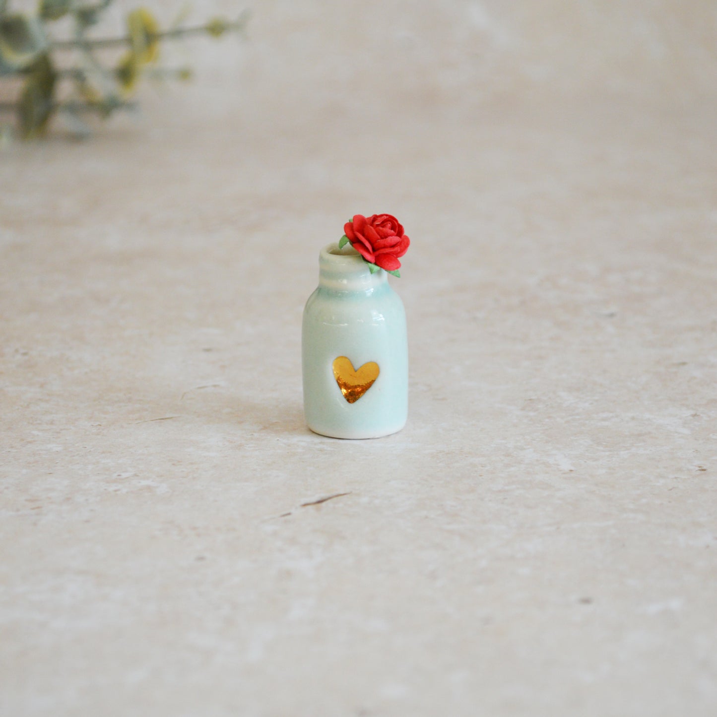 Seconds* Discontinued* Glazed Mini Bottle with an Embossed Gold Heart and a Red Paper Rose A113