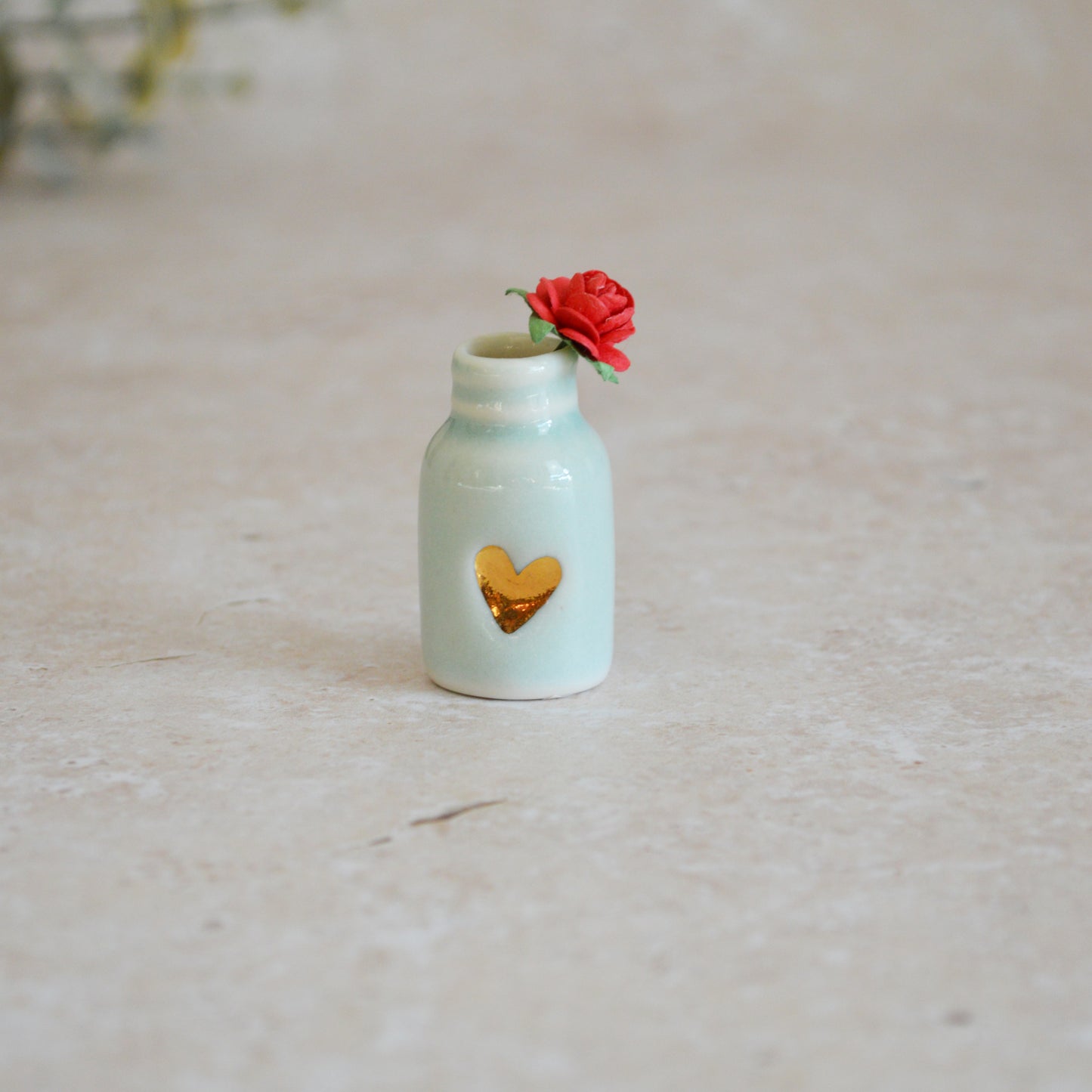 Seconds* Discontinued* Glazed Mini Bottle with an Embossed Gold Heart and a Red Paper Rose A113